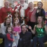 Photo of Betty with storytelling friends and Santa at Woodlands Library